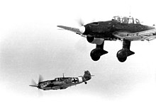 Black and white photograph of two aircraft in flight