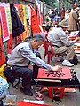 People writing calligraphy on Tết Nguyên Đán in Hanoi.