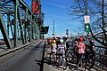 Cyclists waiting during a bridge lift