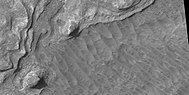 Close view of layers, as seen by HiRISE under HiWish program. Boulders are also visible in the image.