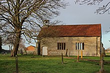Exterior of the building, a small rectangular chapel in stone