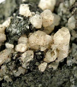 <span class="mw-page-title-main">Anorthite</span> Calcium-rich feldspar mineral