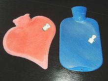 Two modern hot-water bottles shown with their stoppers Warmflasche1.jpg