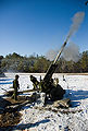 Canadian soldiers fire a high explosive round with a C3 howitzer in 2009.