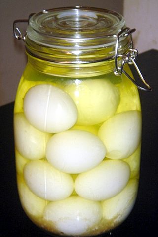 <span class="mw-page-title-main">Pickled egg</span> Hard boiled eggs cured in vinegar or brine