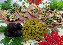 Russian zakuski: cold cuts of tongue topped with mushrooms, cheese, nuts and prunes Tongue Zakuski 2.jpg