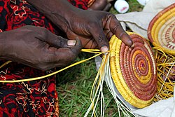 Christine Owney, a Jawoyn resident of the Manyallaluk/Eva Valley community, weaves a basket from pandanus USMC-060916-M-4680H-002.jpg