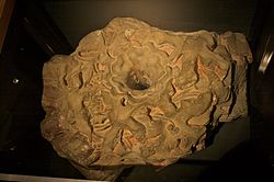 A ceiling boss from Merton Priory, discovered in excavations of Nonsuch Palace, on display in the Museum of London.