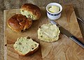 Krentenbollen (currant buns) are usually eaten with butter but sometimes also with cheese, for breakfast, lunch or as a snack