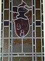 Stained glass 1928 dedication window above entrance to Majestic cinema