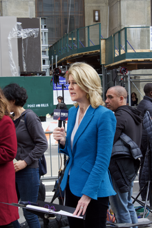 A journalist holding a microphone