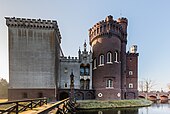 The Gothic Revival tower of the castle on the right