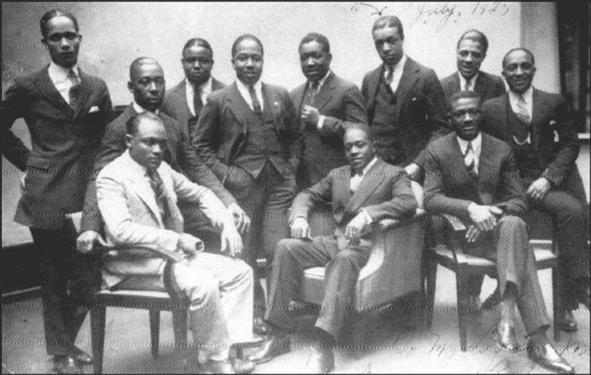 1925 photo taken at the Vox Phonograph Studio — Sam Wooding and his Orchestra; Seated, left to right: Tommy Ladnier (trumpet), John Warren (tuba) (behind), Sam Wooding (piano/leader), Willie Lewis (reeds), George Howe (1892–1936) (drums). Standing, left to right: Herb Flemming (trombone), Eugene Sedric (reeds), Johnny Mitchell (banjo), Bobby Martin (trumpet), Garvin Bushell (reeds), Maceo Elmer Edwards (1900–1988) (trumpet).[1] Not pictured: Arthur Lange (1889–1956), Arthur Johnston (1898–1954), arrangers