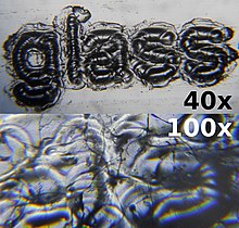 Laser engraved glass microscope slide at 40x and 100x magnification.