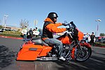 Thumbnail for File:Man Exiting on Orange Touring Bike (2) - Las Vegas Ride for Kids 2019.jpg