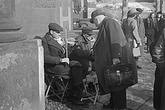 German street performers play for pedestrians in 1948