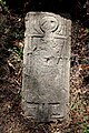 Tombstone with individual holding a duck