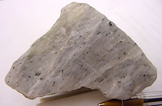 <span class="mw-page-title-main">Nepheline</span> Silica-undersaturated aluminosilicate mineral