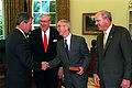 President Bush (left) congratulates Secretary of the Navy Gordon R. England (center), Secretary of the Air Force James G. Roche (2nd from left) and Secretary of the Army Thomas E. White (right) following their swearing in ceremony in the White House Oval Office on June 18, 2001.