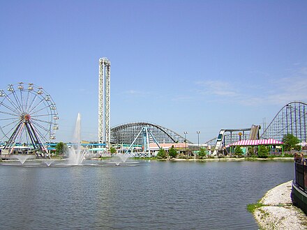 Waterfront view west from Jazz Plaza over Crescent City Basin; L–R: prominent rides include The Big Easy ferris wheel, Sonic Slam/Baou Blaster, and Mega Zeph