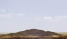 A photograph of the mound of sand that comprises the destroyed remains of the pyramid, called 'Merenre's beauty shines', that belonged to Merenre Nemtyemsaf I.