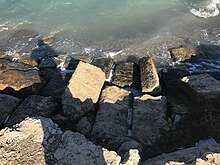 Blocks of the ancient Corinthian Diolkos fall into the Gulfof Corinth