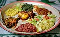 Image 3A plate of Injera with various Eritrean stews (from Culture of Eritrea)