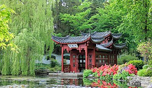 Building depicting a boat in the Chinese garden of the Hidden Realm of Ming pavilion.