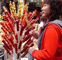 A large batch of tanghulu made with various fruits sold along the street in Shanghai. Tanghulu-shanghai.jpg