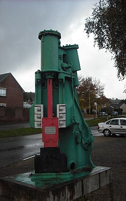 A steam hammer from Panteg steelworks is preserved outside the Griffithstown railway museum Steam hammer, Griffithstown.jpg