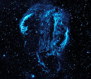 This GALEX image of the Cygnus Loop nebula could not have been taken from the surface of the Earth because the ozone layer blocks the ultra-violet radiation emitted by the nebula.