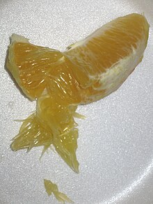 A segment of an orange that has been opened to show its pulp. Citrus pulp1.JPG