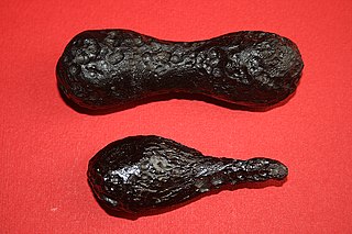 <span class="mw-page-title-main">Tektite</span> Gravel-sized glass beads formed from meteorite impacts