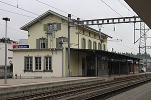 Three-story building with gabled roof