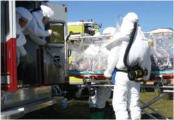 The AIT conducting training in PPE while transporting a mock patient in an ATI at Fort Detrick. (Photo by Bruce Maston, 2007) AIT1.png