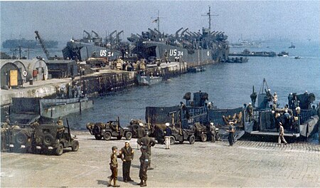 LST-374 and LST-314 loading supplies at an English port in preparation for the Invasion of Normandy, early June 1944. LST-374 and LST-314.jpg