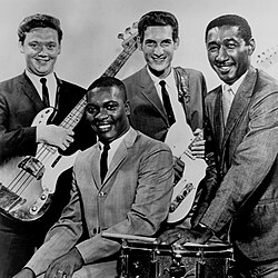 Booker T. & the M.G.'s c. 1967 (L–R): Donald "Duck" Dunn, Booker T. Jones (seated), Steve Cropper, Al Jackson Jr.