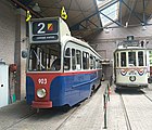 De Amsterdamse motorwagen 903 in de remise. Ernaast de Haagse motorwagen 274. Beide trams zijn overgenomen van de Elektrische Museumtramlijn Amsterdam; 29 juli 2022.