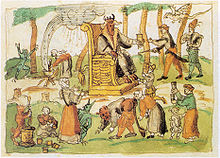 Sixteenth-century Swiss representation of Sabbath gathering from the chronicles of Johann Jakob Wick. Note the horned god seated on serpent-enlaced throne, witch performing the osculum infame upon a demon and another being aided by a demon to summon a storm from her cauldron, while others carouse and prepare magic potions Hexensabbat.jpg