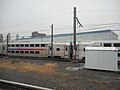 A New Jersey Transit commuter train passes by on the way to Penn Station as it leaves the Sunnyside Yard.