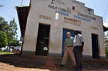 Capt. Jon Cutler, a chaplain and the religious affairs director for Combined Joint Task Force – Horn of Africa, walks with Rabbi Gershom Sizomu at the Moses Synagogue, Abayudaya