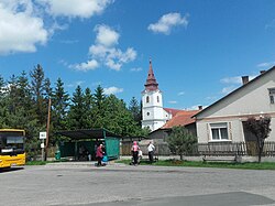 The main square of Varbó with a local church and bus stop