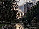 The swan pond at the Boston Public Garden with a view of the Arlington Street Church steeple.