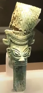 Bronze figure With towering hair excavated in 2021