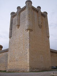 A stone tower at the corner of the defensive walls.