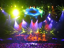 Phish in concert at the Alpine Valley Music Theatre in East Troy, Wisconsin, in July 2003, accompanied by a light show created by Chris Kuroda Alpine.jpg