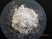 Heap of white powder on a watch glass