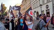 Small group of young people with various flags