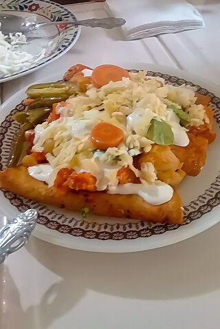 <span class="mw-page-title-main">Entomatada</span> Mexican dish made of folded corn tortilla fried and bathed in tomato sauce