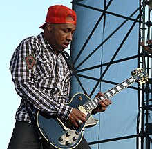 Johnson onstage playing guitar